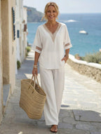 Women's embroidered V-neck top and wide-leg pants set by FitiqueFit in four colors, featuring intricate embroidery and relaxed fit.