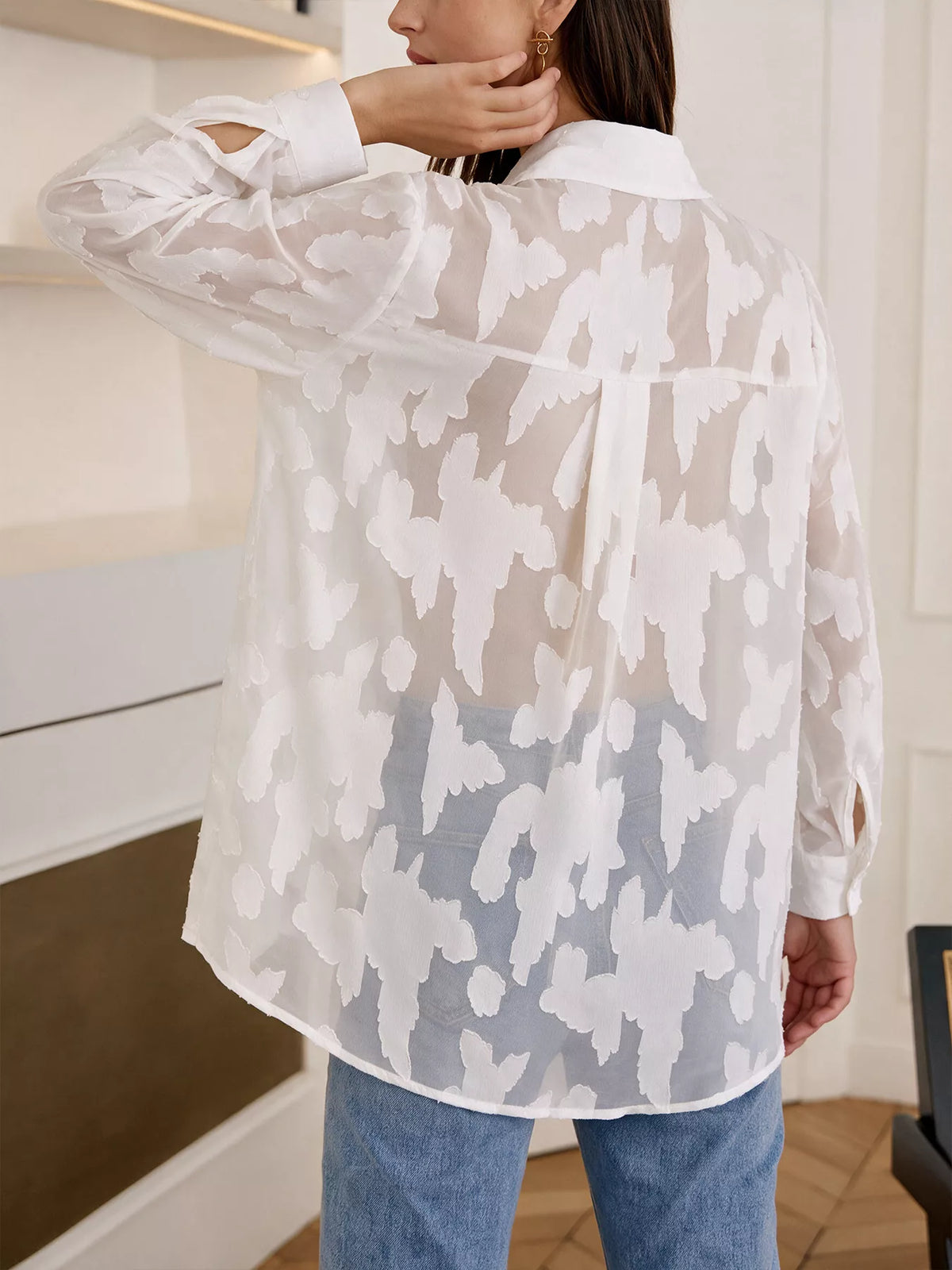 Light pink sheer button-down shirt from Trendsi, featuring a classic collar and long sleeves, styled on a mannequin.