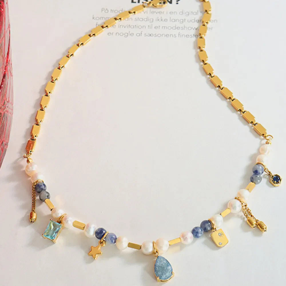 18K gold-plated beaded charm necklace with delicate charms and a stylish chain, perfect for layered or everyday wear.