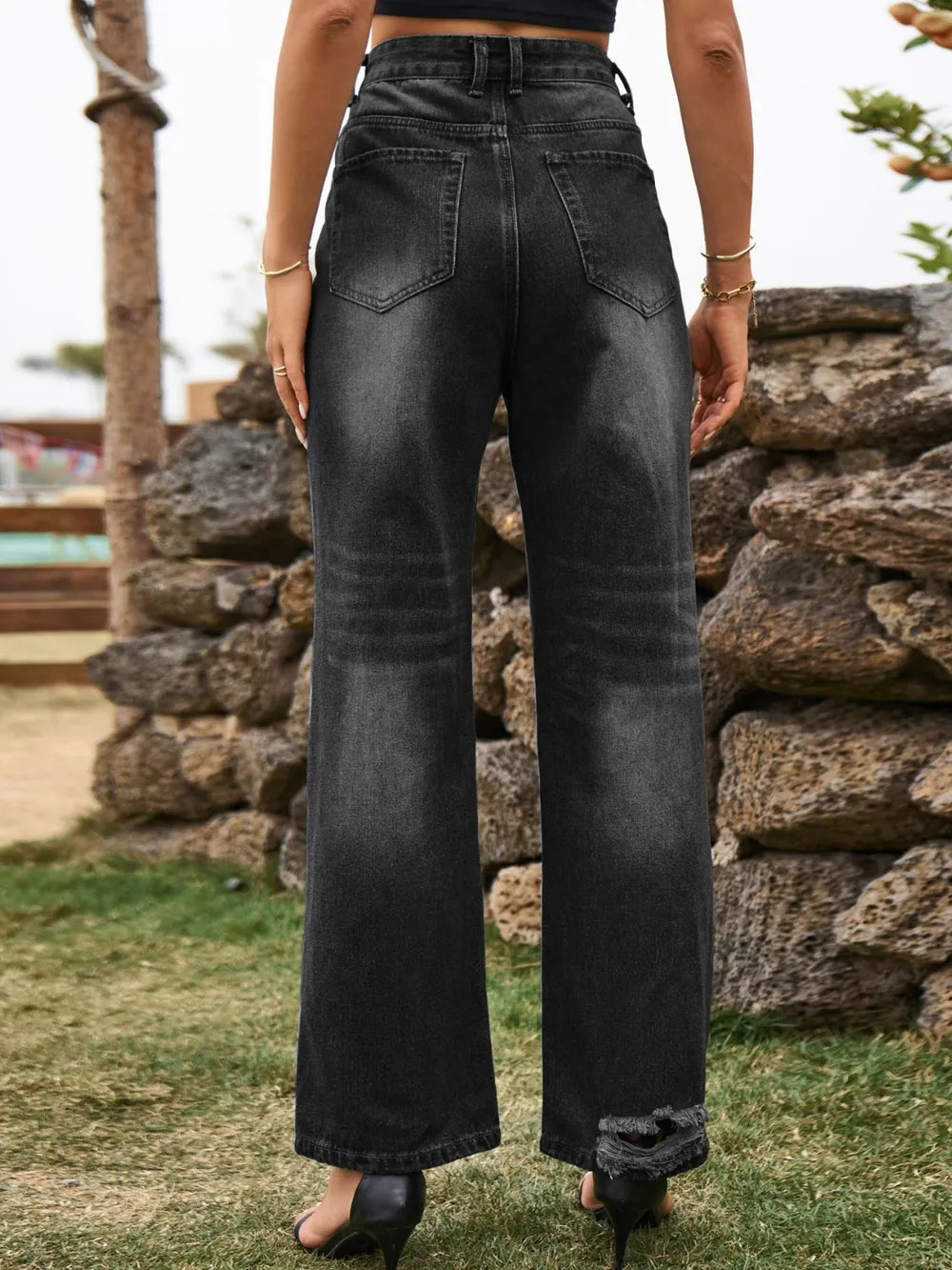 Distressed Plush Fashion Hub denim jeans with pockets, showcasing a trendy, worn-in look and classic five-pocket design.
