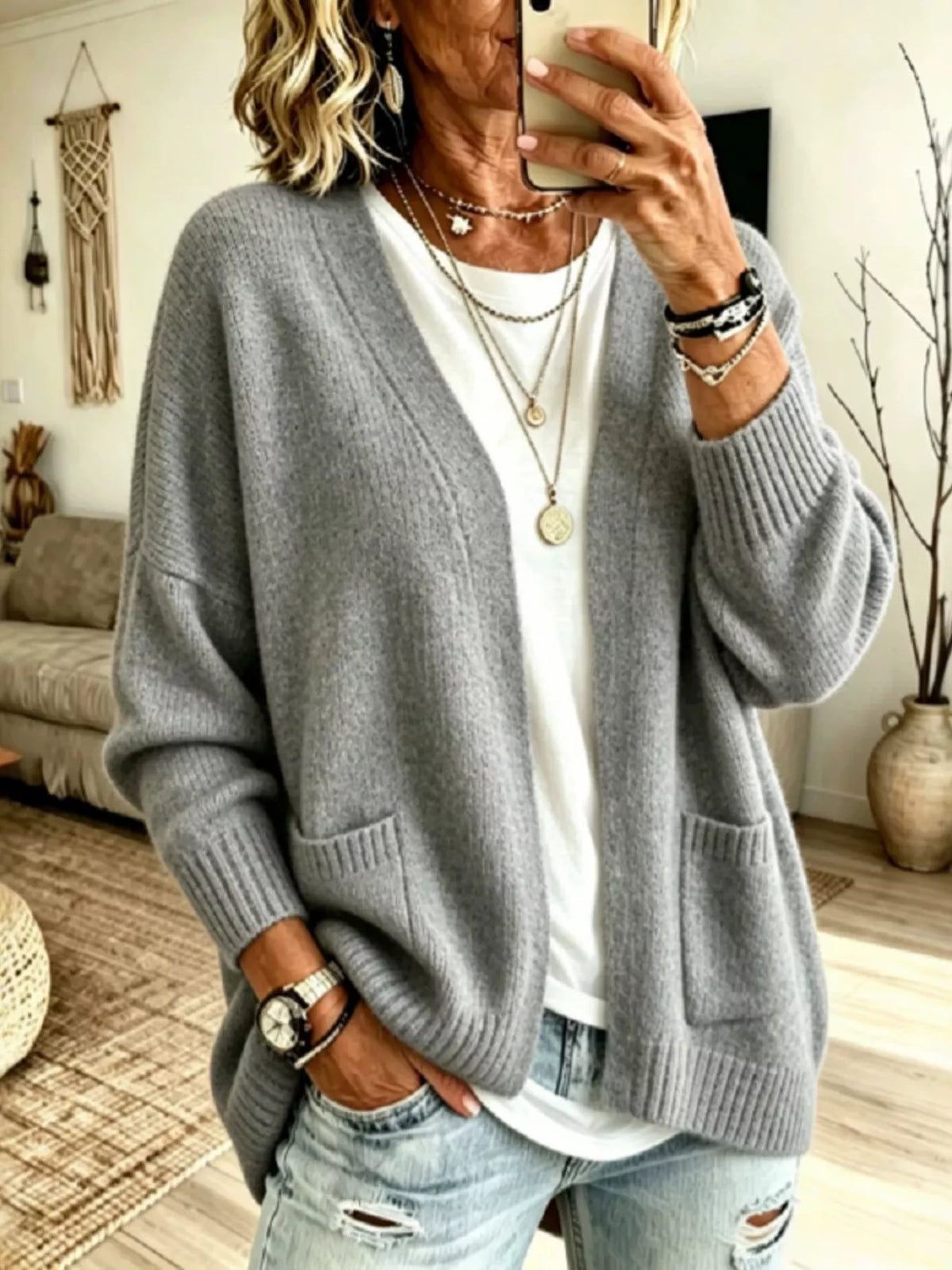 Open front knit cardigan with pockets from Trendsi, featuring a cozy, lightweight design and a versatile, casual style.