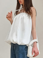Women’s strapless bubble hem tube top by Trendsi, featuring a sleek minimalist design and trendy crop top style, shown in the image.
