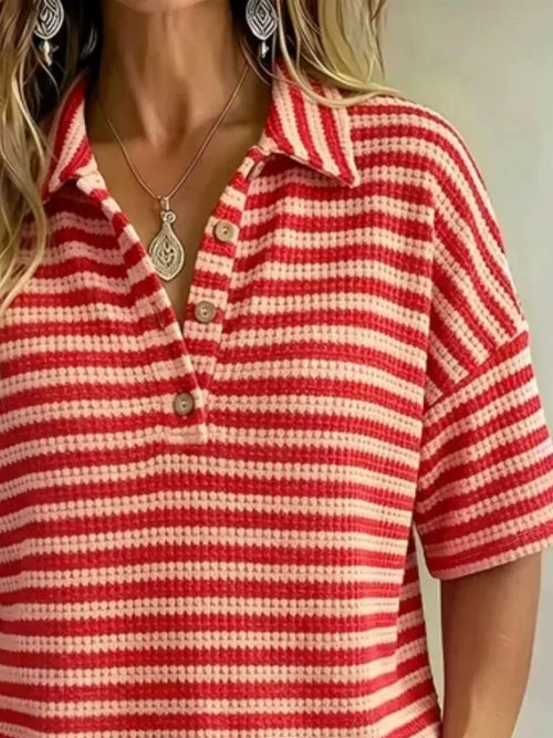 Plus size contrast striped knit polo shirt from Trendsi, showing the full front view of the colorful, fitted tops with collar and short sleeves.