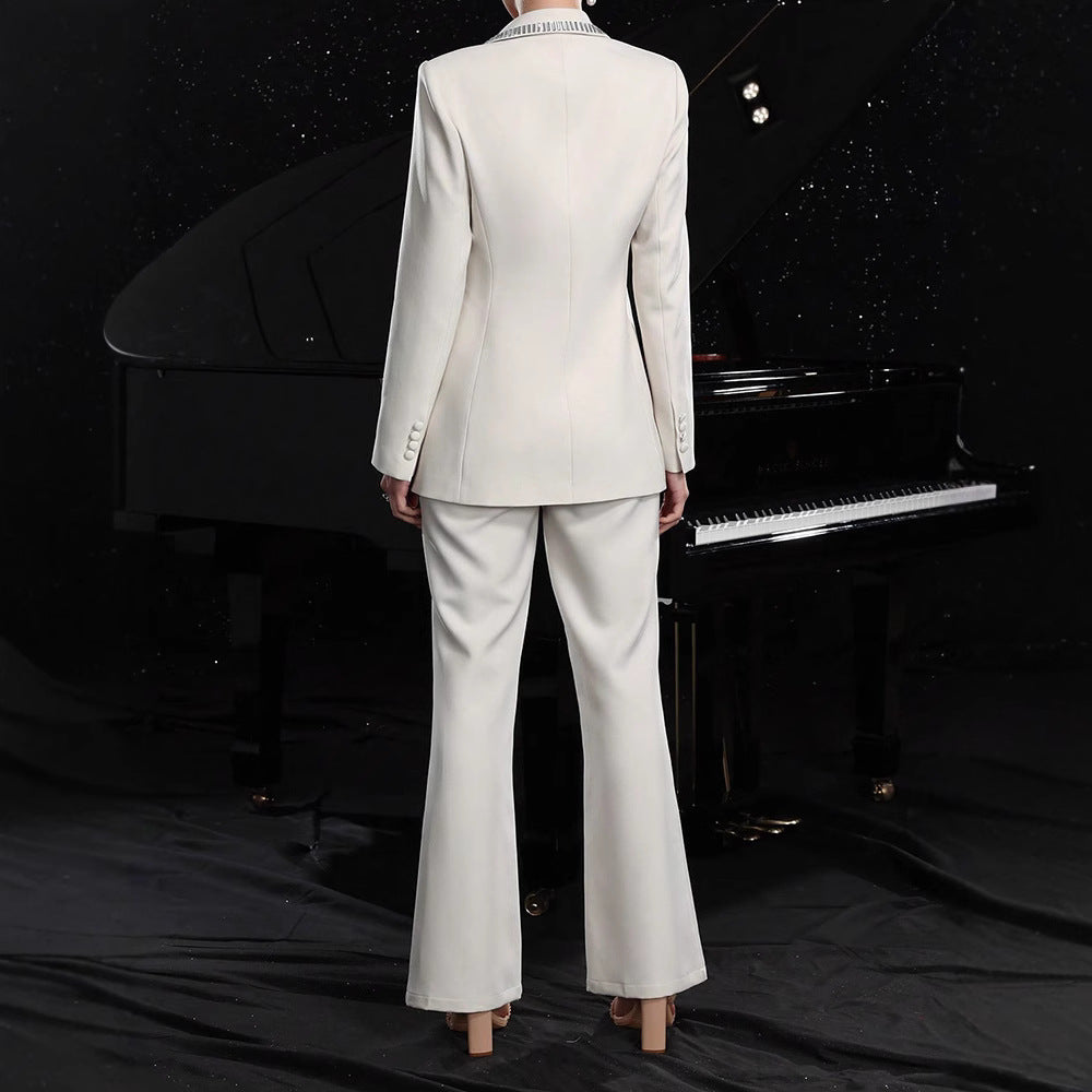 Women's elegant hollow-out long-sleeve suit jacket and pants set by FitiqueFit, featuring stylish cutouts and tailored fit.