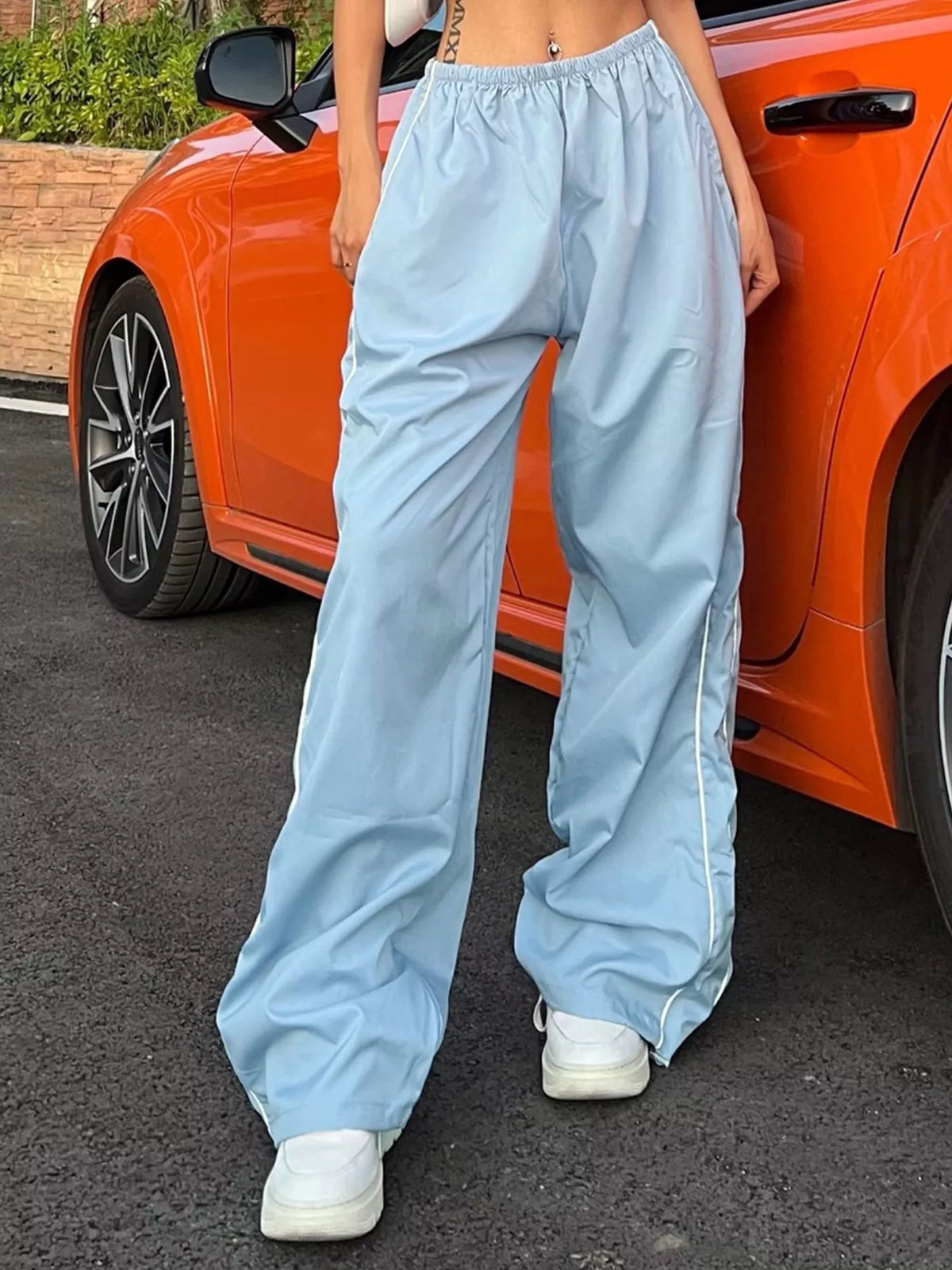 Lightweight high-rise wide-leg women's pants with elastic waist from Plush Fashion Hub, shown in a relaxed fit dress style.