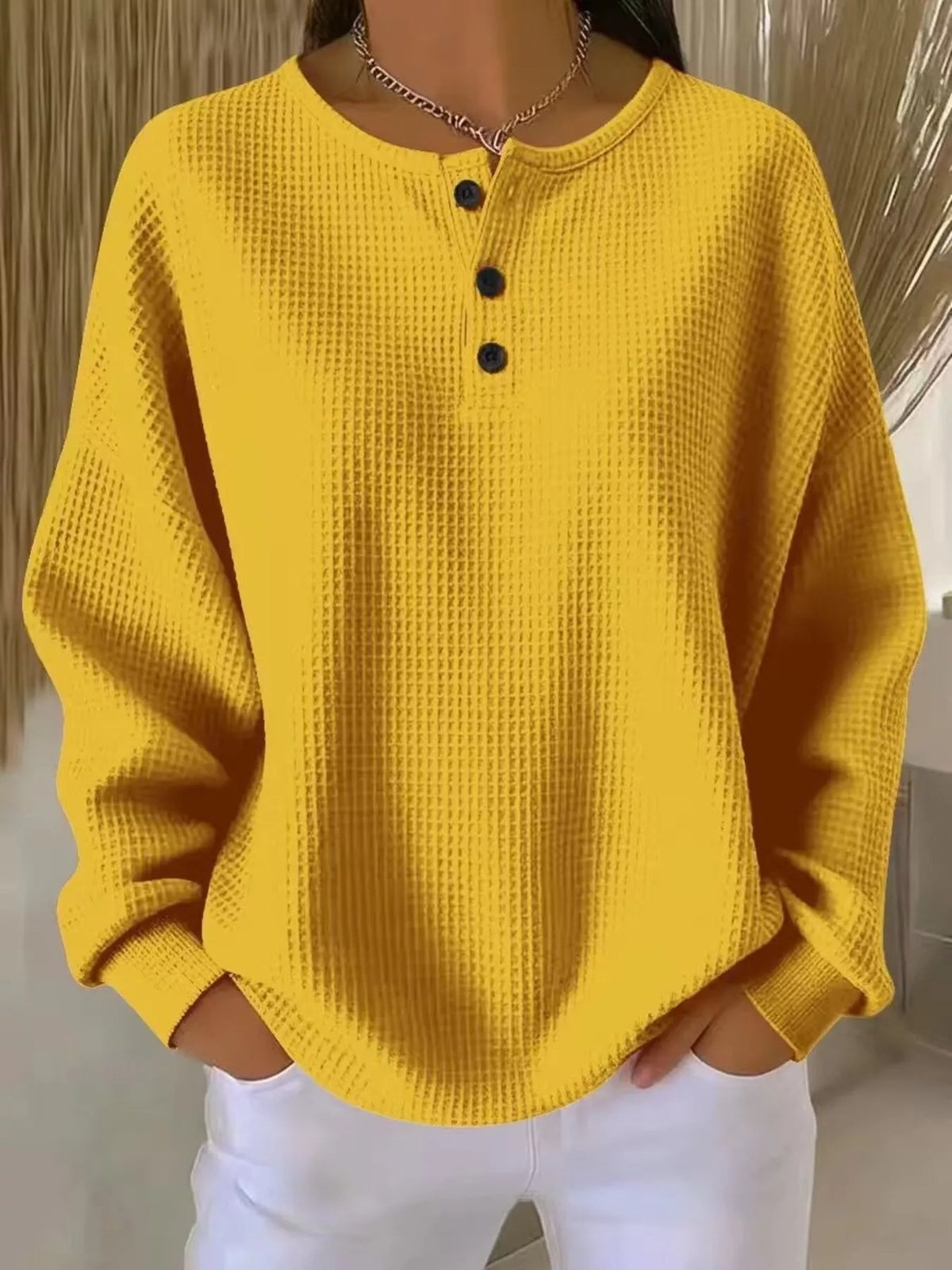 Plus size waffle knit top with button details from Trendsi, featuring a cozy, textured fabric and casual fit.