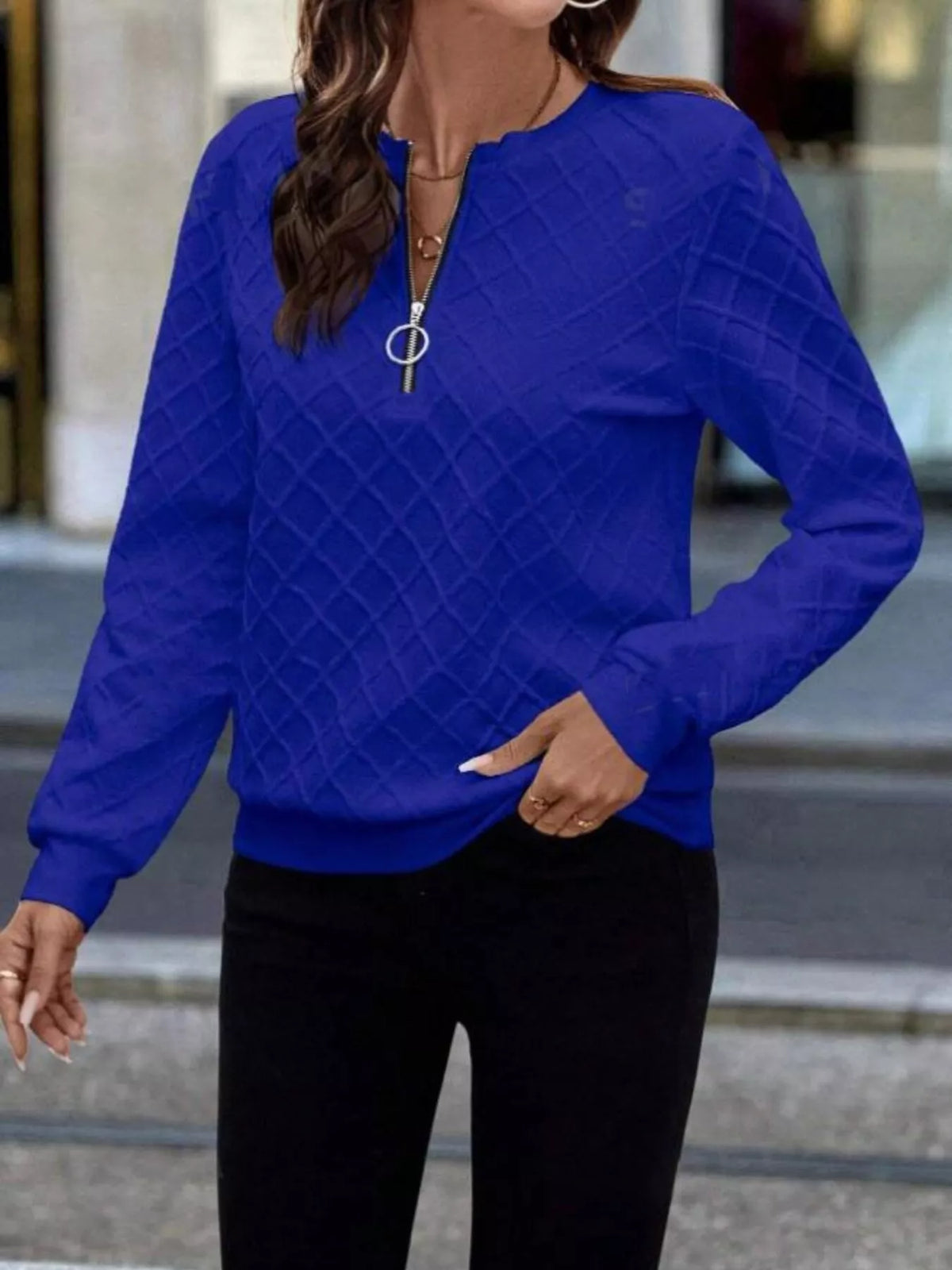 Textured quarter-zip sweatshirt in plush fabric by Plush Fashion Hub, displayed on a hanger with detailed fabric close-up.