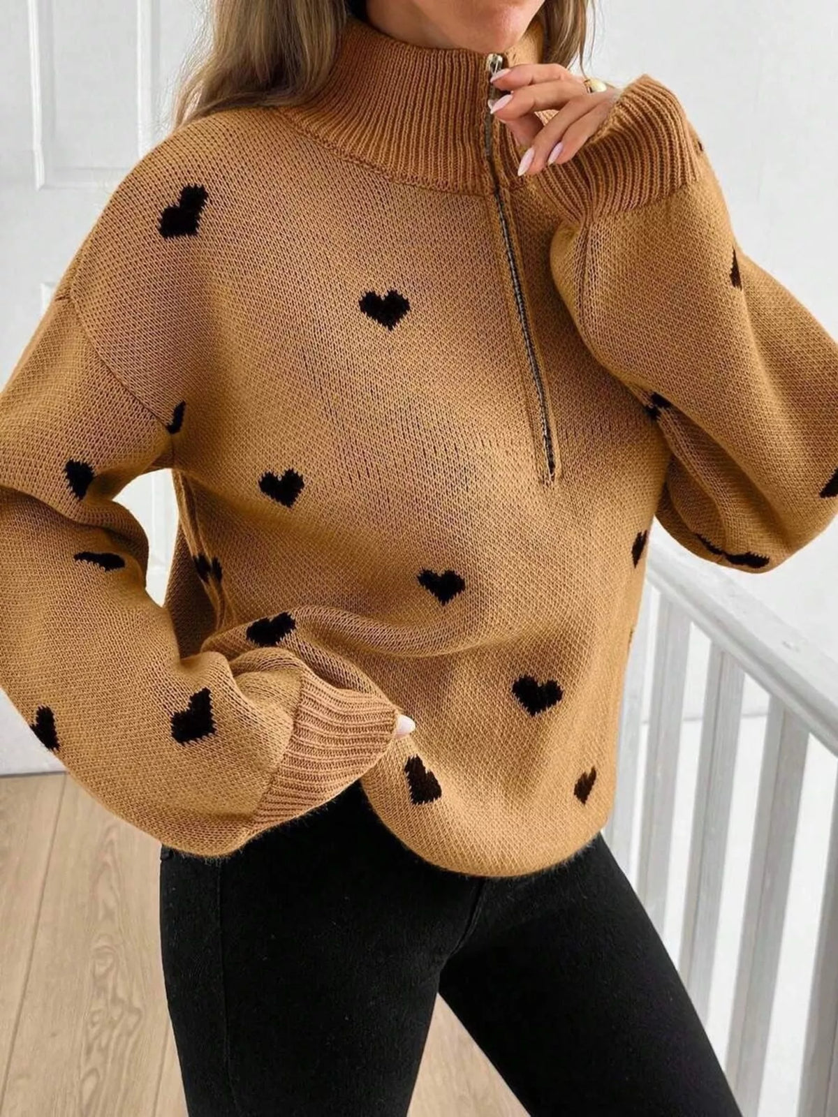 Plus size full heart half-zip long sleeve sweater by Trendsi, featuring a cozy design and a stylish heart pattern.