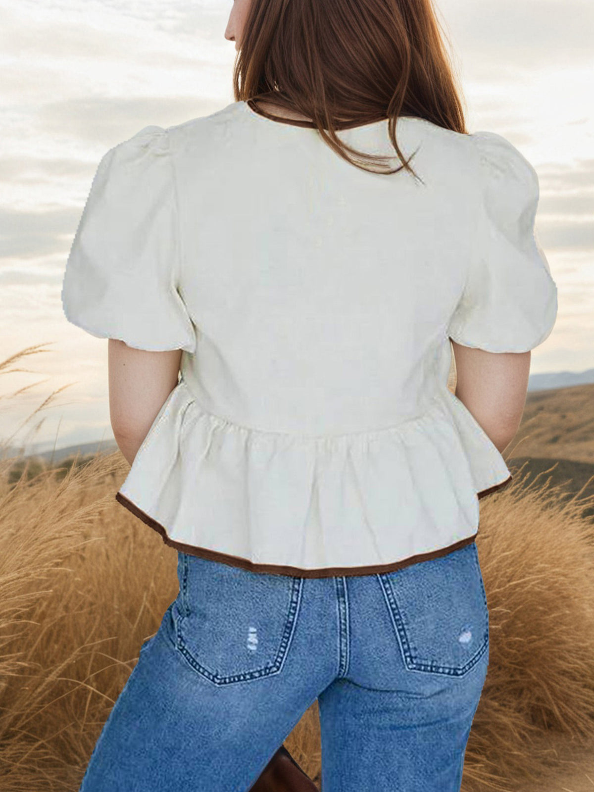 Elegant tie-front puff sleeve peplum blouse by Plush Fashion Hub, featuring a stylish design and feminine silhouette.