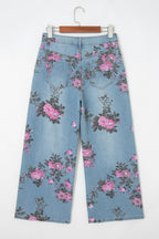 Threaded Pear Esme floral print bootcut jeans showing a stylish denim pair with colorful floral patterns and classic bootcut fit.
