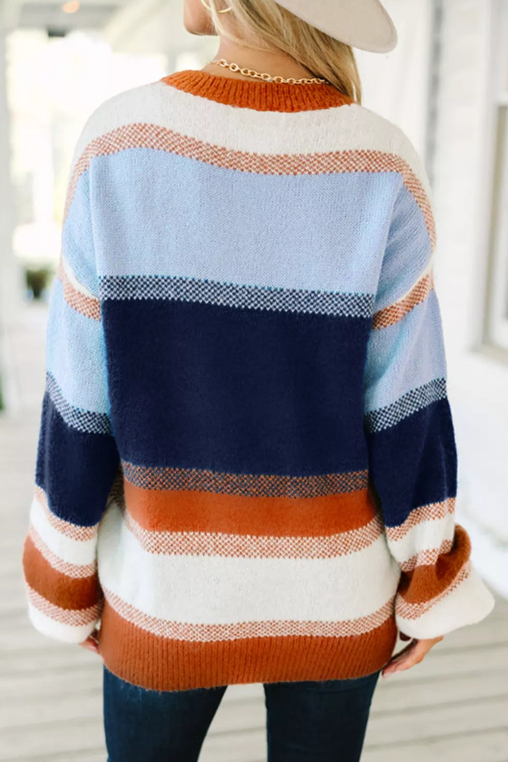 Color block round neck sweater from Trendsi featuring a stylish, cozy design with bold color blocks and a comfortable fit.