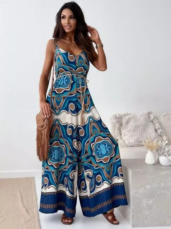 Printed spaghetti strap wide-leg jumpsuit by Plush Fashion Hub, featuring a stylish design and comfortable fit.