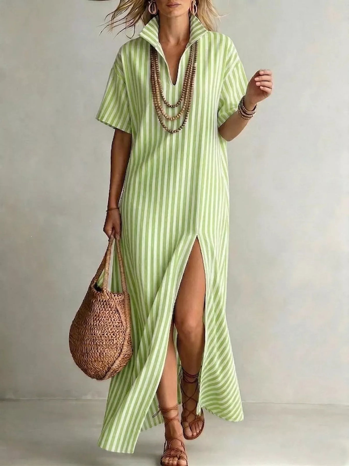 Plus size striped maxi dress with side slit, trendy full-figure dress by Trendsi shown in the image.