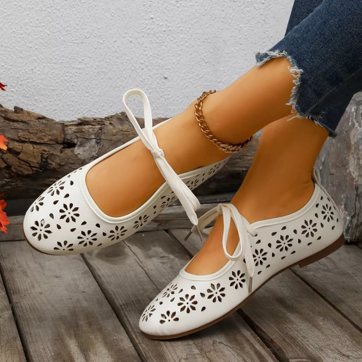 Floral cutout tied slip-on sandals from Plush Fashion Hub featuring a stylish open-toe design and decorative floral accents.