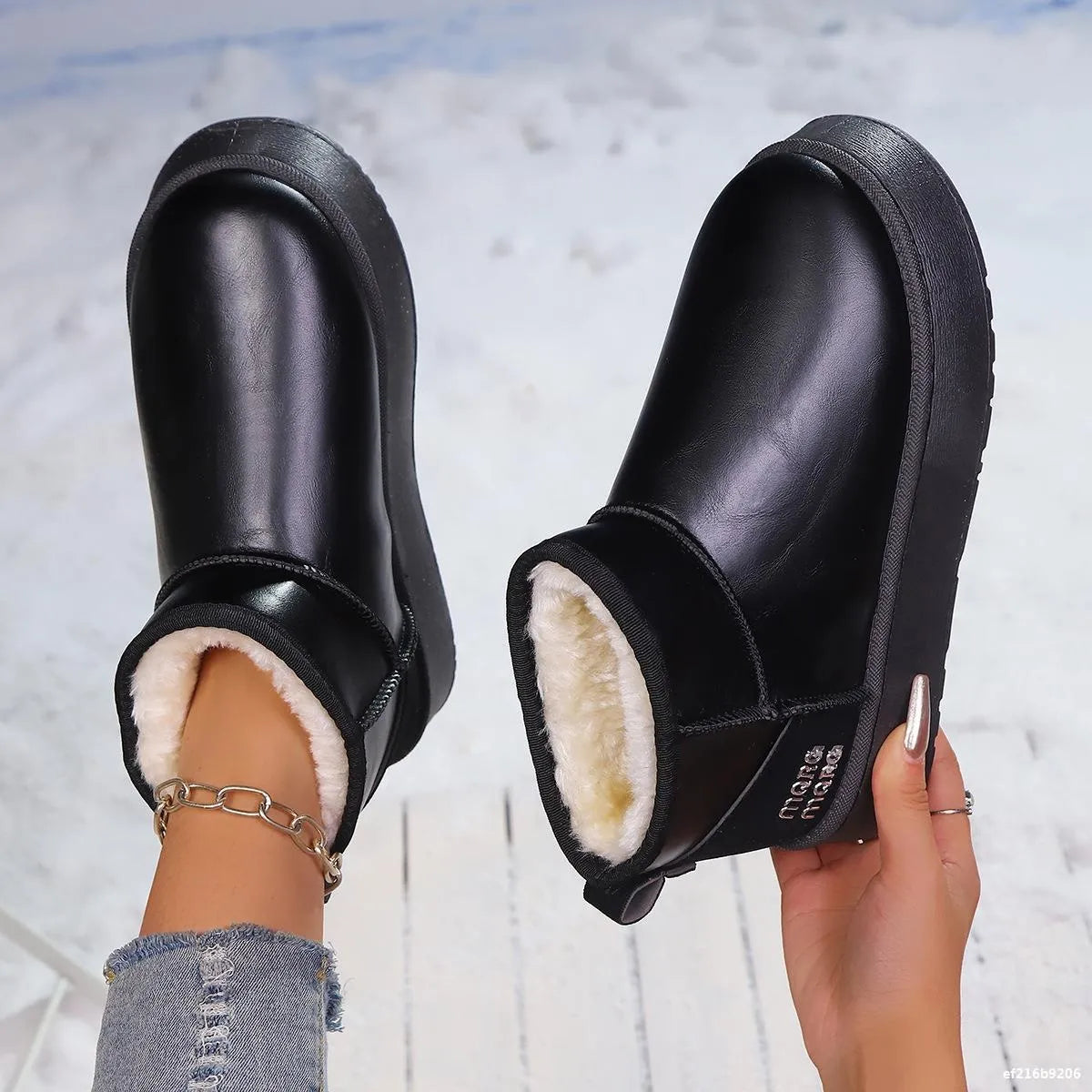 Trendsi faux-fur platform ankle boots showing black faux fur exterior with chunky soles and ankle height design.