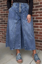 High-waisted wide-leg button-fly jeans in classic cotton denim, featuring a relaxed fit and front pockets.