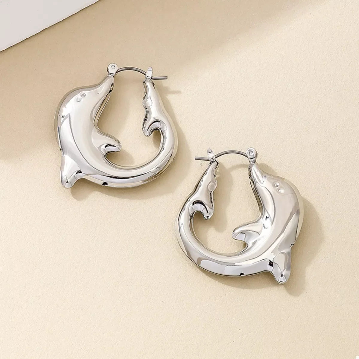18K gold-plated dolphin hoop earrings with detailed marine dolphin design, stylish jewelry by Plush Fashion Hub
