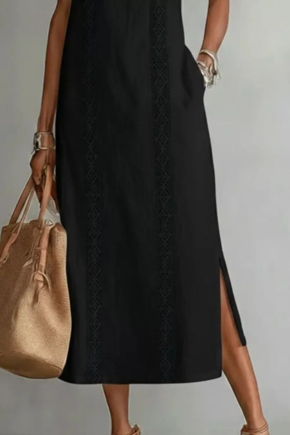Women's sleeveless side slit maxi dress with pockets by Trendsi, featuring a flowing fabric and stylish slit detail.
