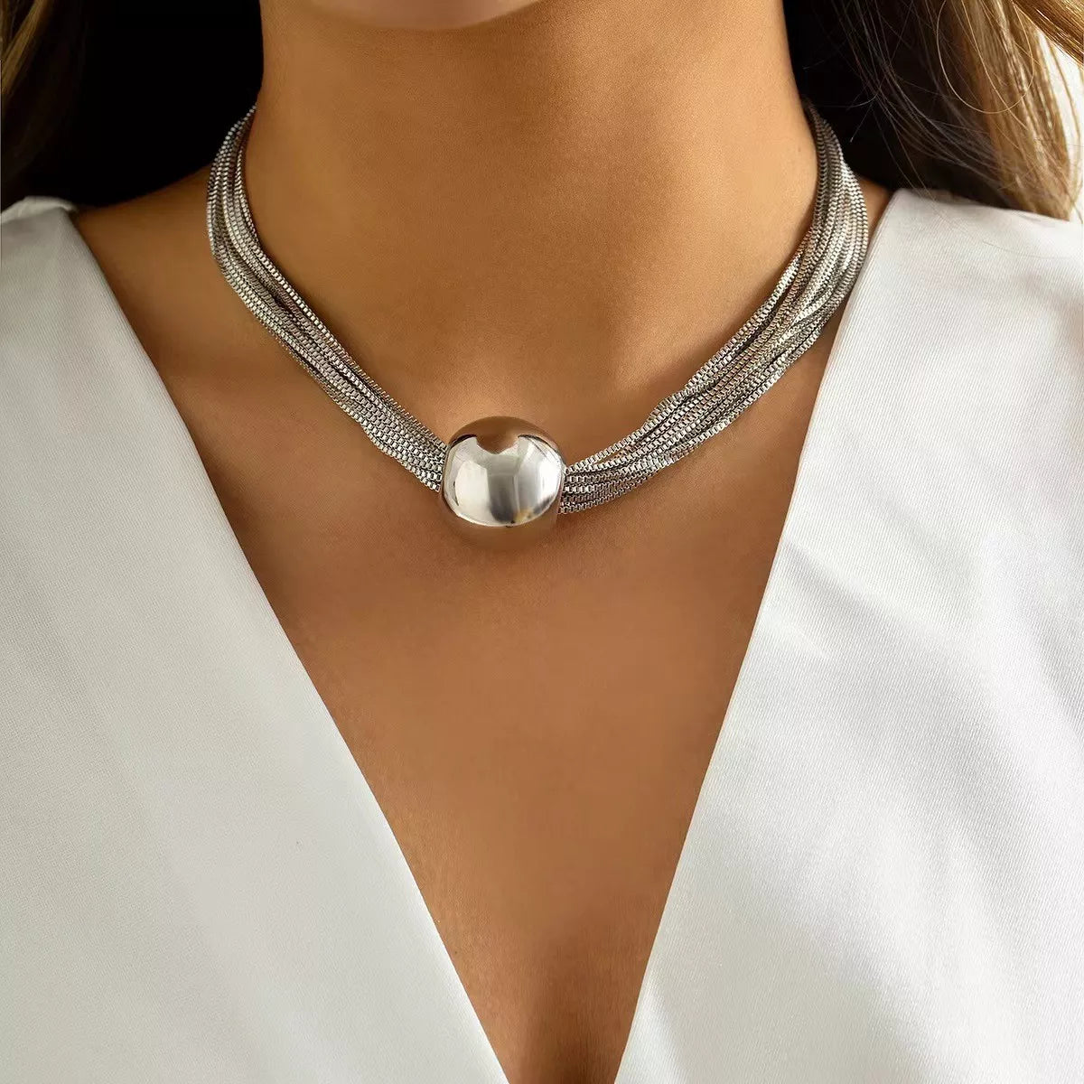 Multi-layered adjustable necklace with delicate chains, stylish design, from Plush Fashion Hub, displayed on a neutral background.