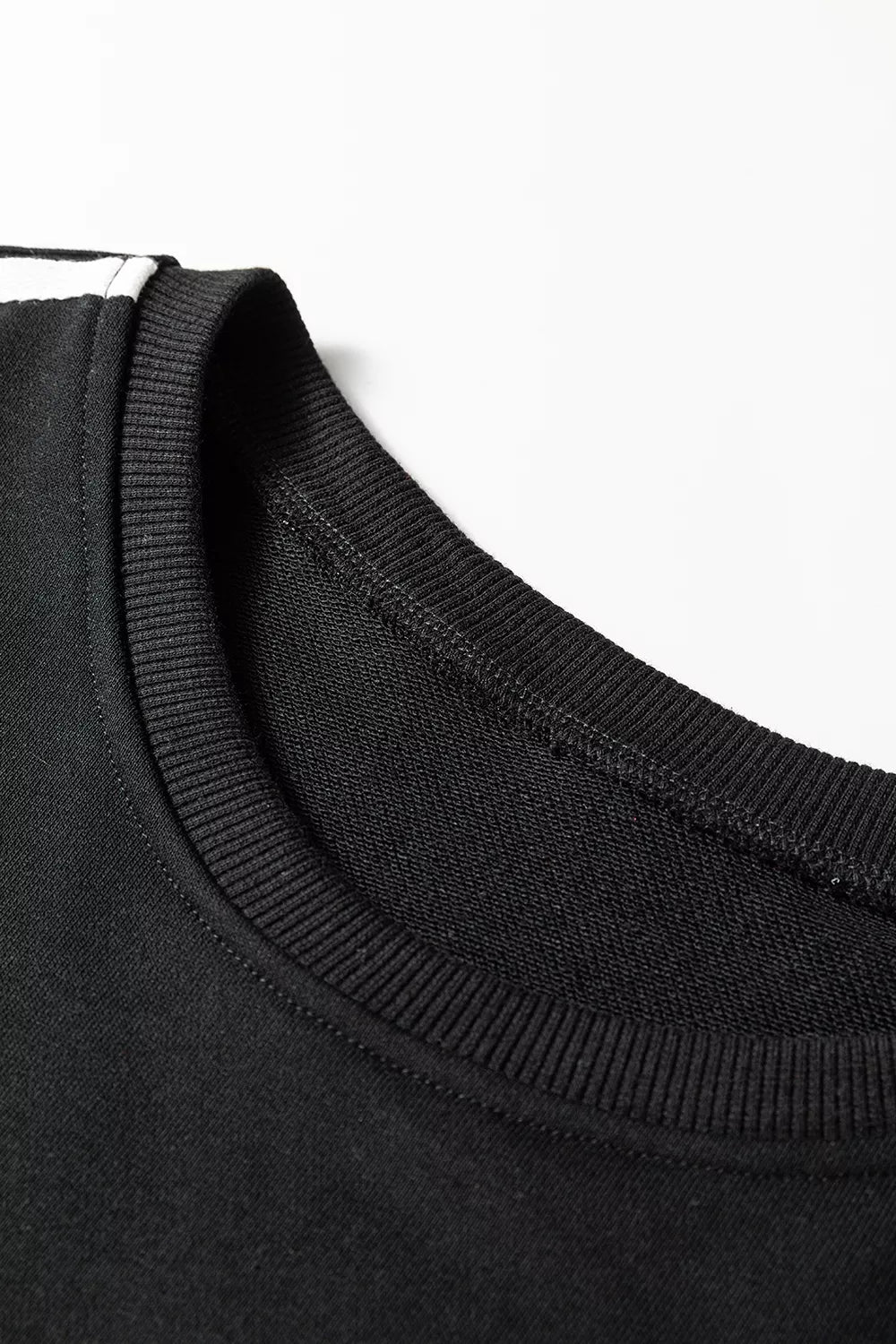 Striped detail crewneck pullover and elastic sweatpants 2-piece outfit by Trendsi, featuring casual, comfortable knit fabric and stylish design.