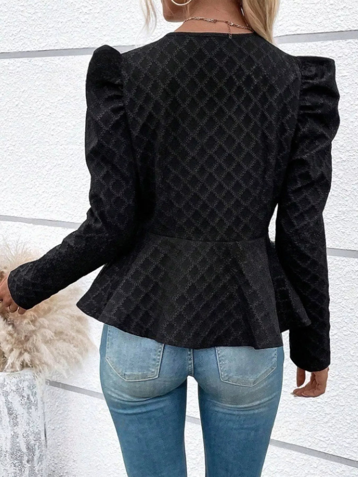 Women’s textured jacquard jacket with puff sleeves, stylish and trendy, featuring a structured fit and intricate fabric pattern.