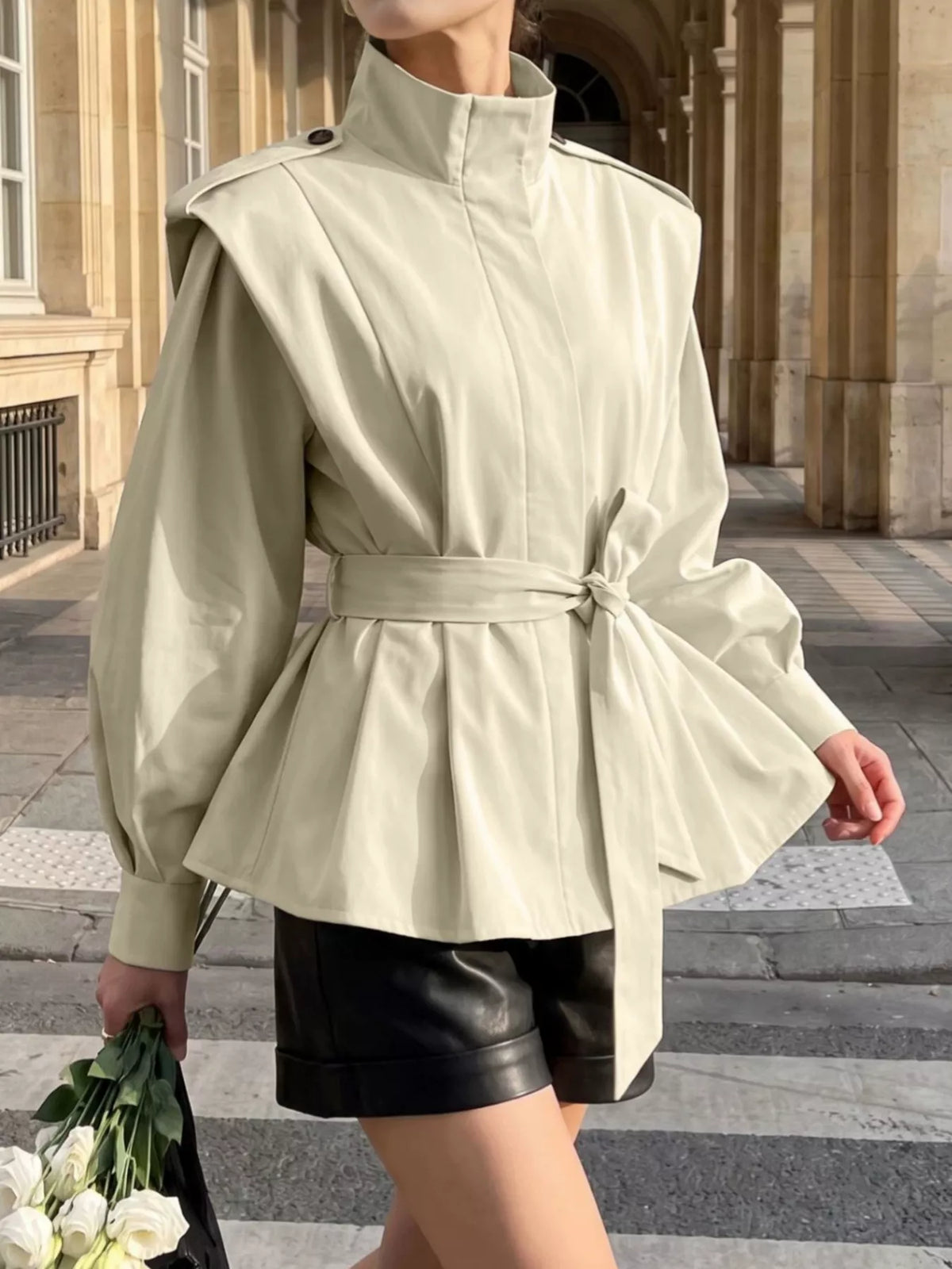 Trendsi stand-collar belted outerwear jacket with front pockets, lightweight design, and neutral color for stylish layering.