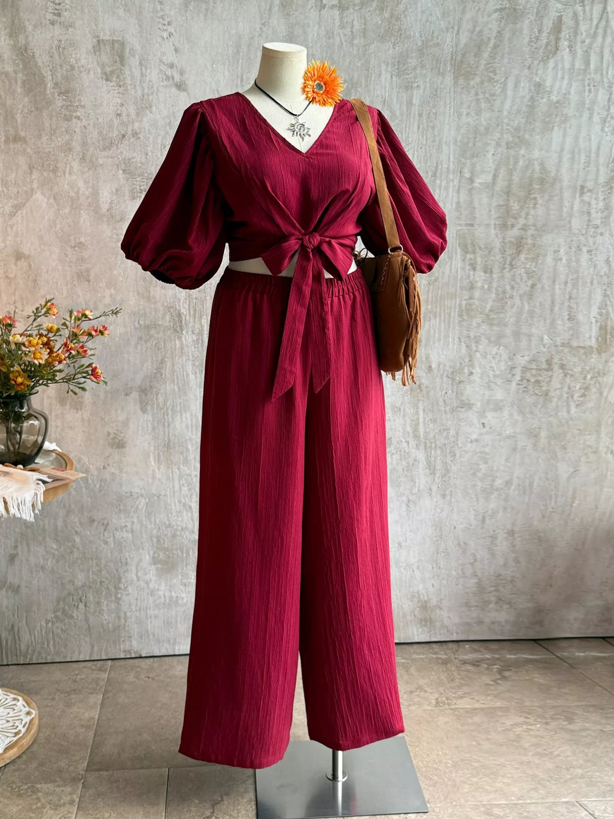 Plus size tie-front puff sleeve top and wide-leg pants set by Plush Fashion Hub, featuring stylish, comfortable two-piece outfit.