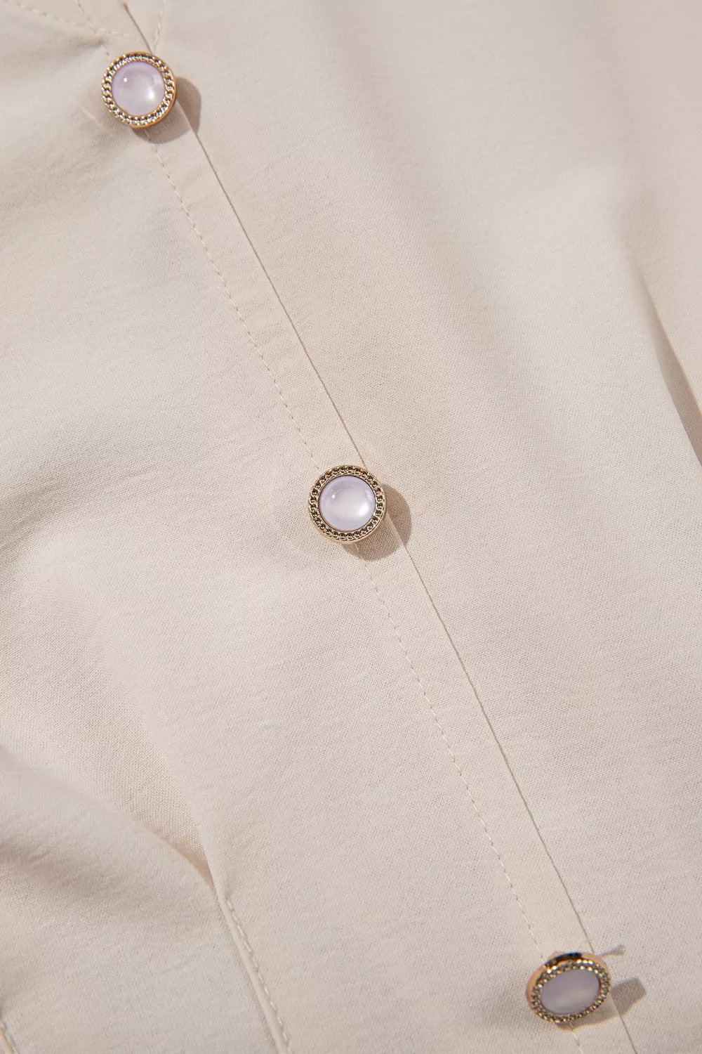 Plush Fashion Hub V-neck long sleeve blouse with smocked waist, elegant design, in a soft fabric, showcased on a model.