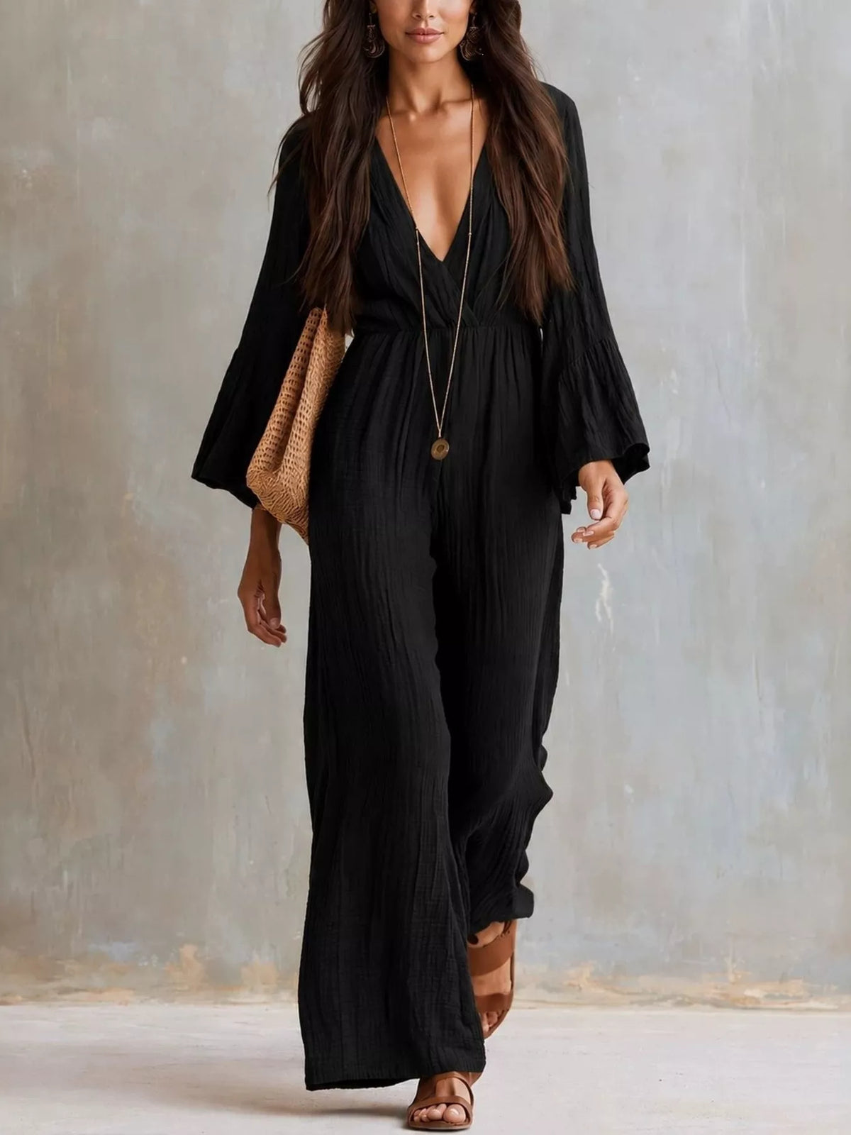 Textured flare sleeve jumpsuit for women featuring a stylish design and trendy fit, perfect for casual or dressy occasions.