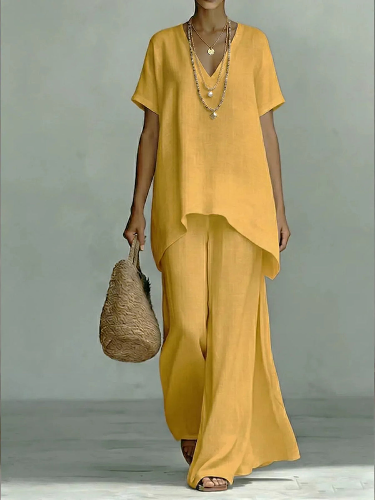 Plus size V-neck top and wide-leg pants set by Plush Fashion Hub, stylish two-piece outfit with comfortable fit.