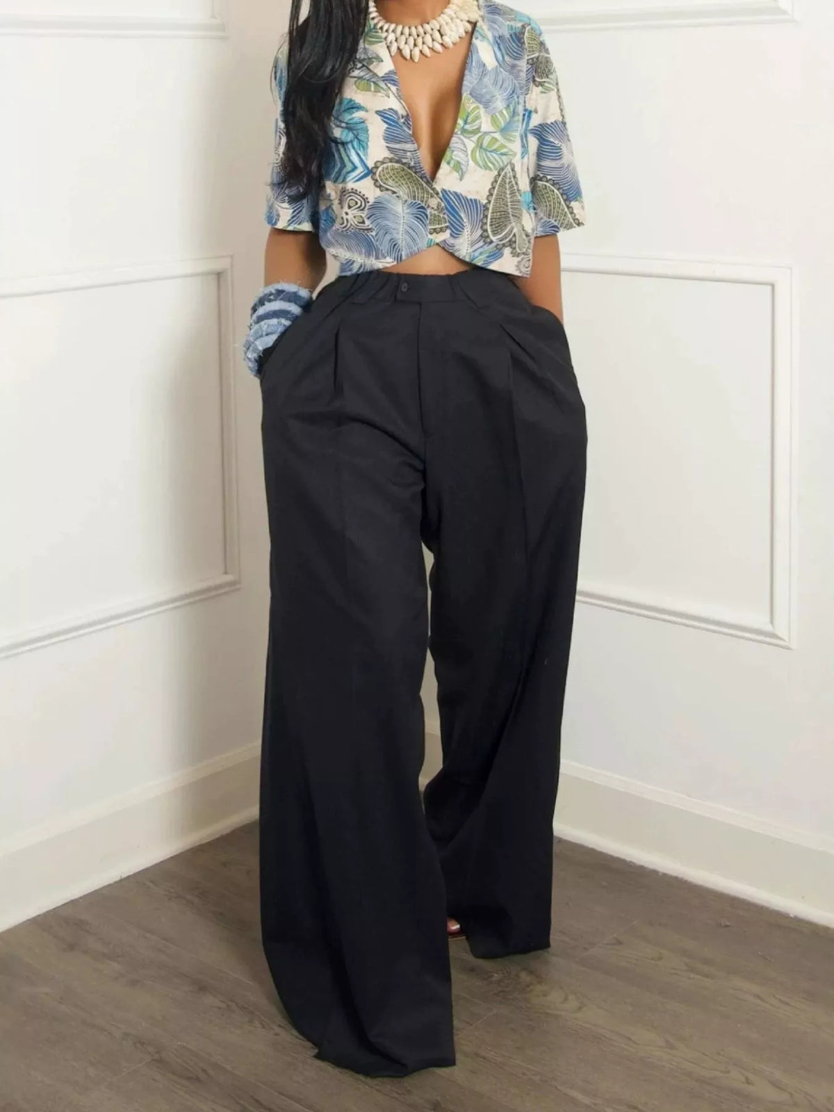 Wide leg pleated pants for women from Trendsi, featuring high waist and flowy fabric, styled on a model.