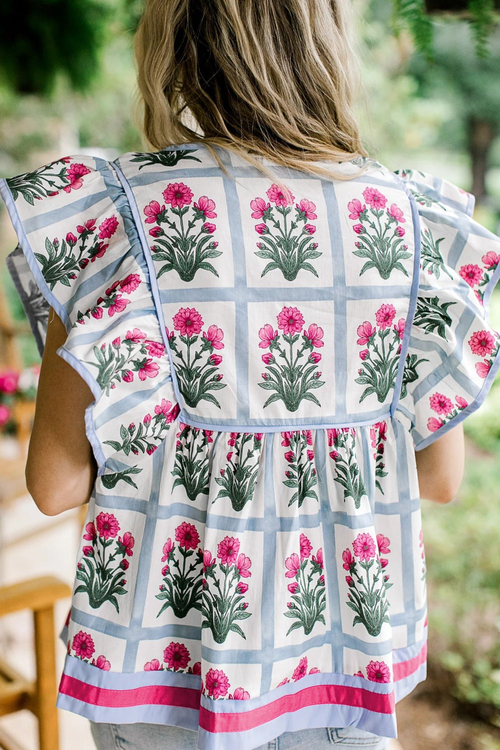 Women’s floral print ruffle sleeve blouse with tied neckline, lightweight and stylish, by Plush Fashion Hub.