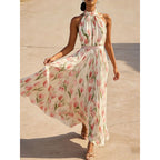 Women's halterneck high-waist swing dress by FitiqueFit featuring floral and solid print casualwear, flowing fabric and sleeveless design.