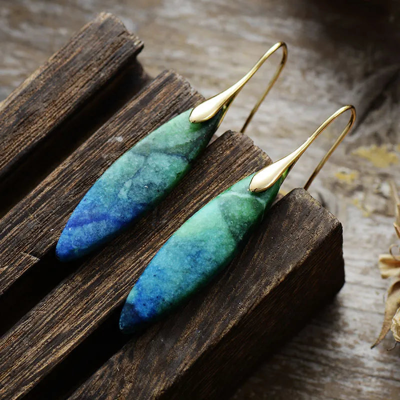 Natural stone geometric copper earrings with modern design, featuring metallic and stone elements for stylish fashion accessories.