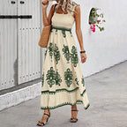 Women’s wide-strap printed maxi dress by FitiqueFit, casualwear with vibrant floral pattern and flowing fabric.