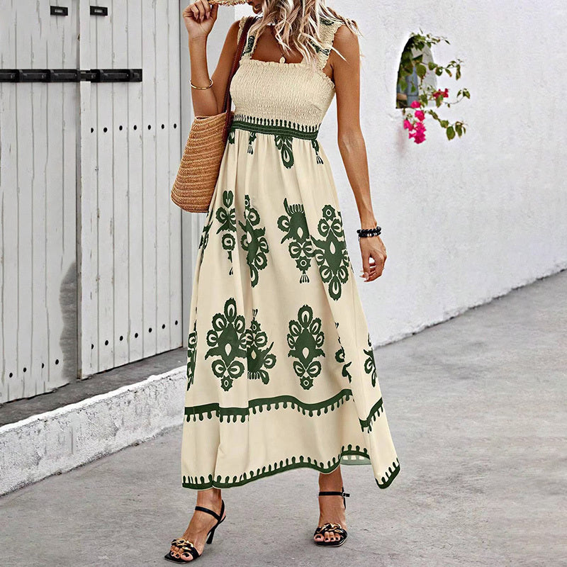 Women’s wide-strap printed maxi dress by FitiqueFit, casualwear with vibrant floral pattern and flowing fabric.