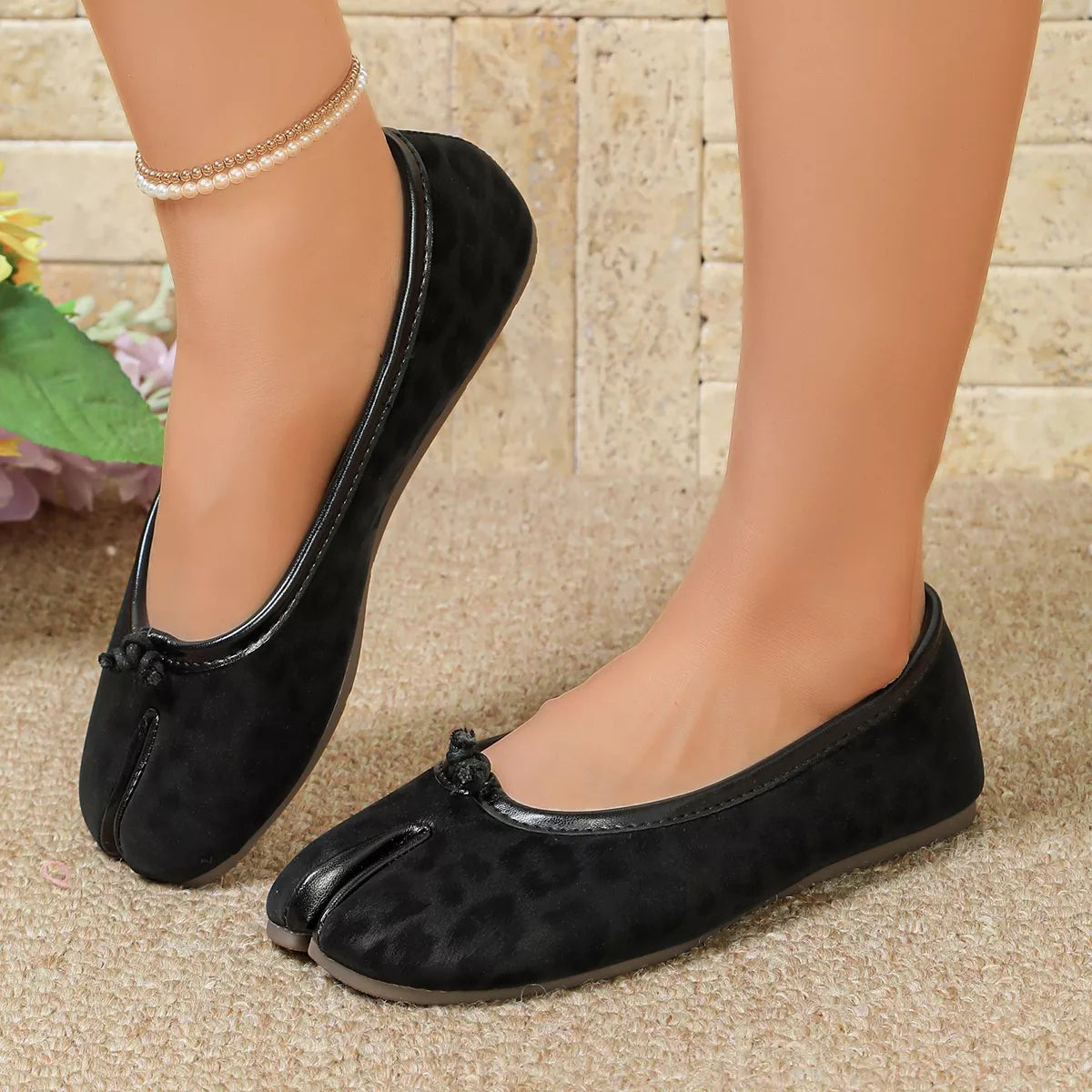 Leopard print split-toe slip-on shoes by Trendsi featuring a stylish slip-on design and comfortable fit.