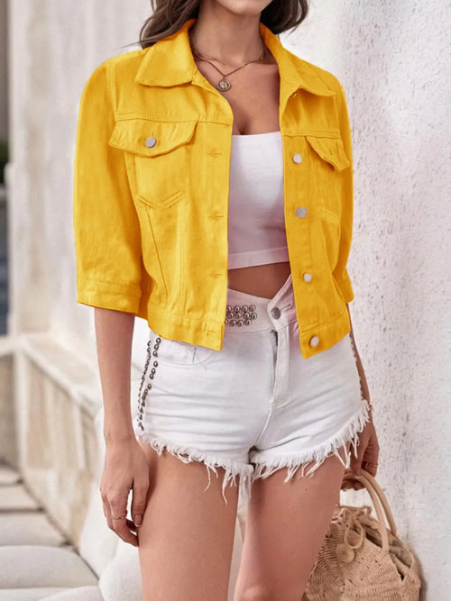 Plus size cropped denim jacket by Trendsi, showing classic blue denim with button-front and long sleeves on a model.