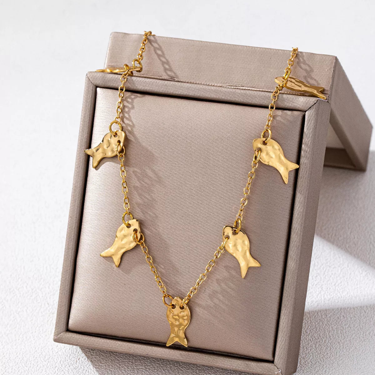 18K gold-plated fish charm necklace featuring a delicate fish pendant, stylish accessory from Plush Fashion Hub.