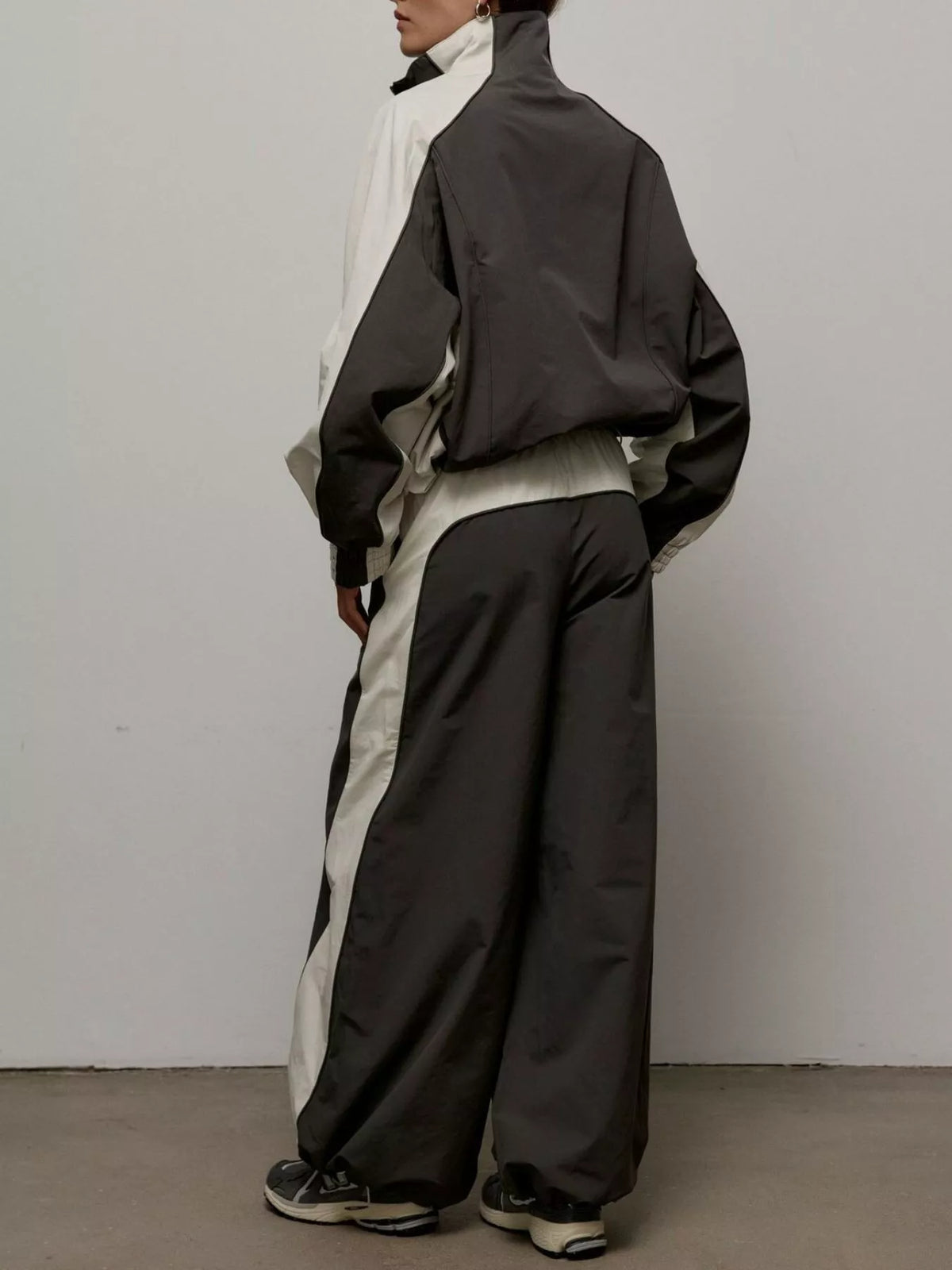 Color block zip-up outerwear and pants set by Plush Fashion Hub, featuring vibrant color blocking and comfortable fit.