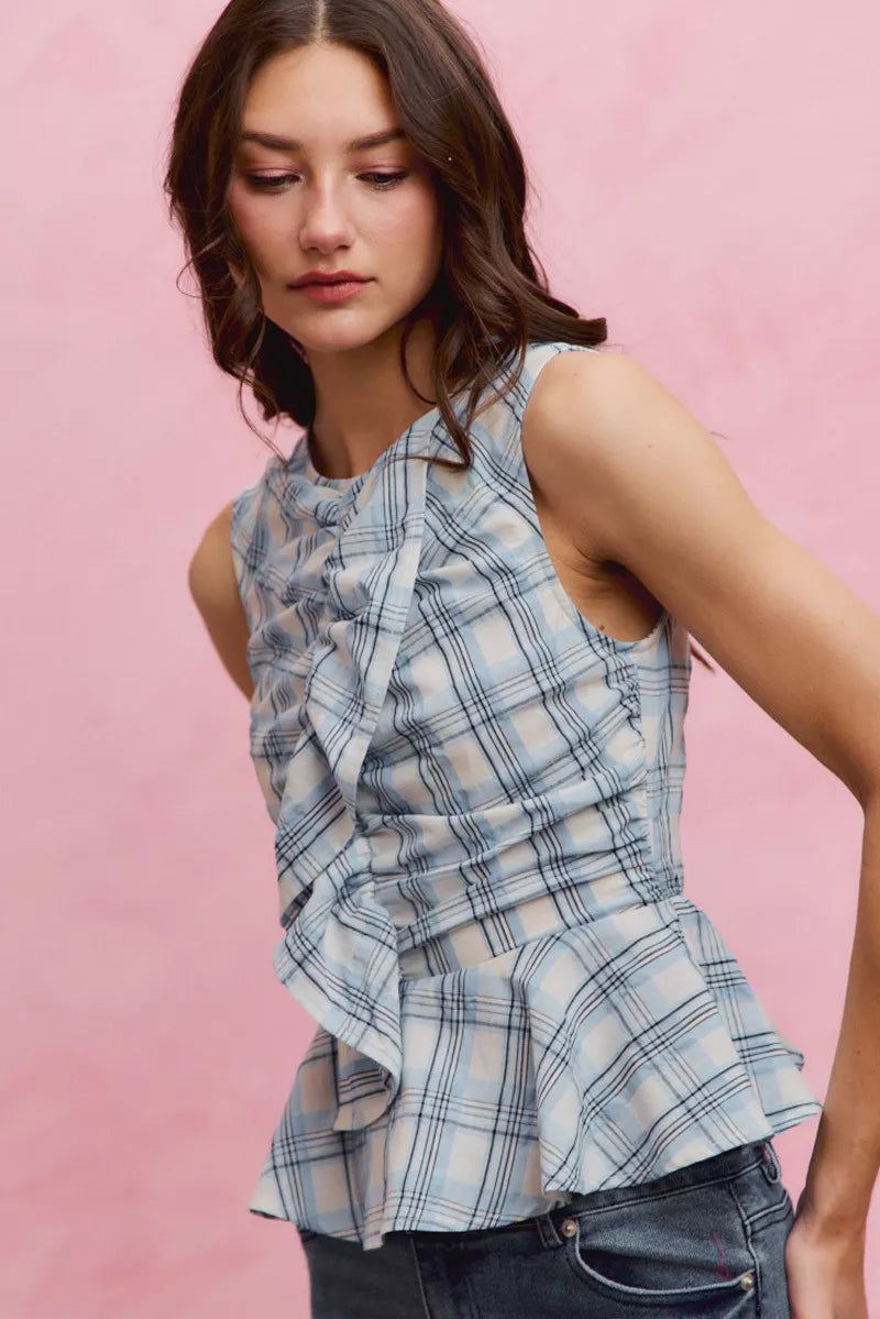 Plaid sleeveless ruffle peplum top from Plush Fashion Hub, featuring a fitted waist and stylish ruffle details.
