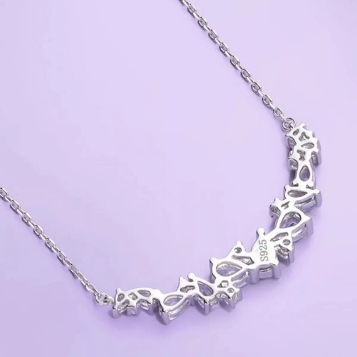 Sterling silver zircon necklace featuring a delicate chain and sparkling pendant, showcasing elegant jewelry design.