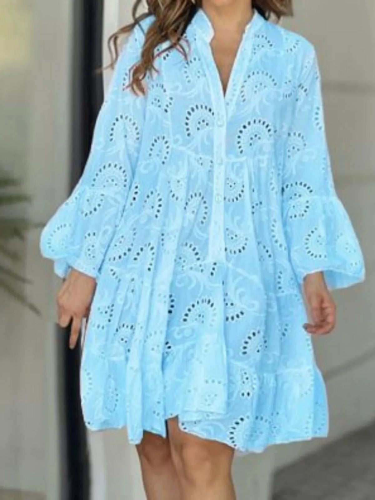 Plus size full-length eyelet ruffled hem tiered dress by Trendsi, showing the flowy fabric and tiered design details.