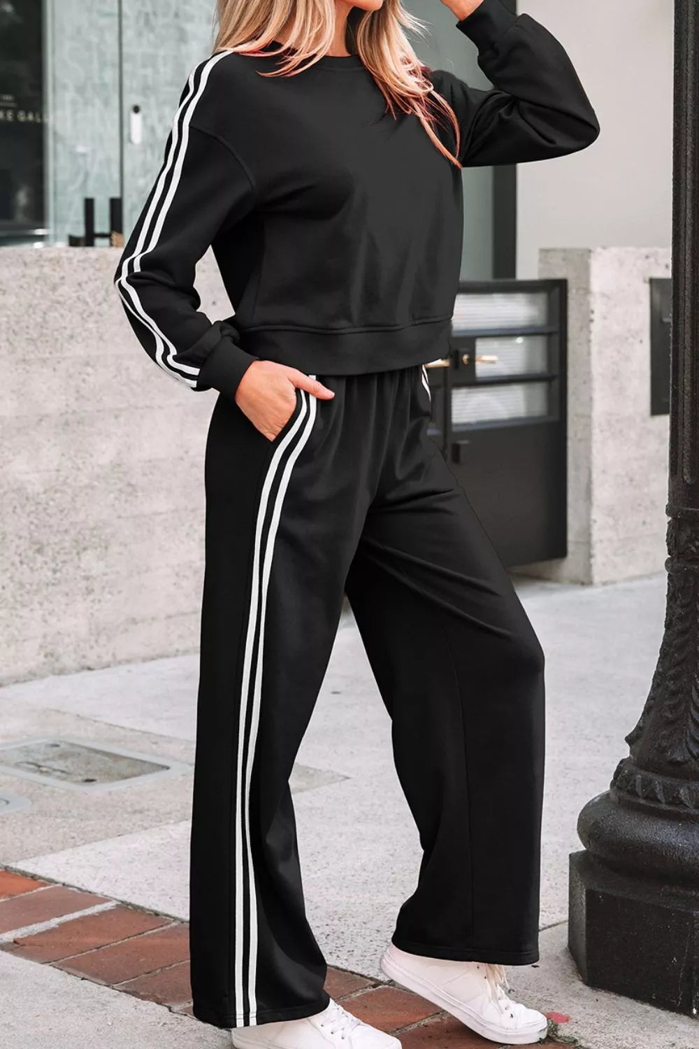 Striped detail crewneck pullover and elastic sweatpants set by Trendsi, featuring a casual striped design and comfortable fit.