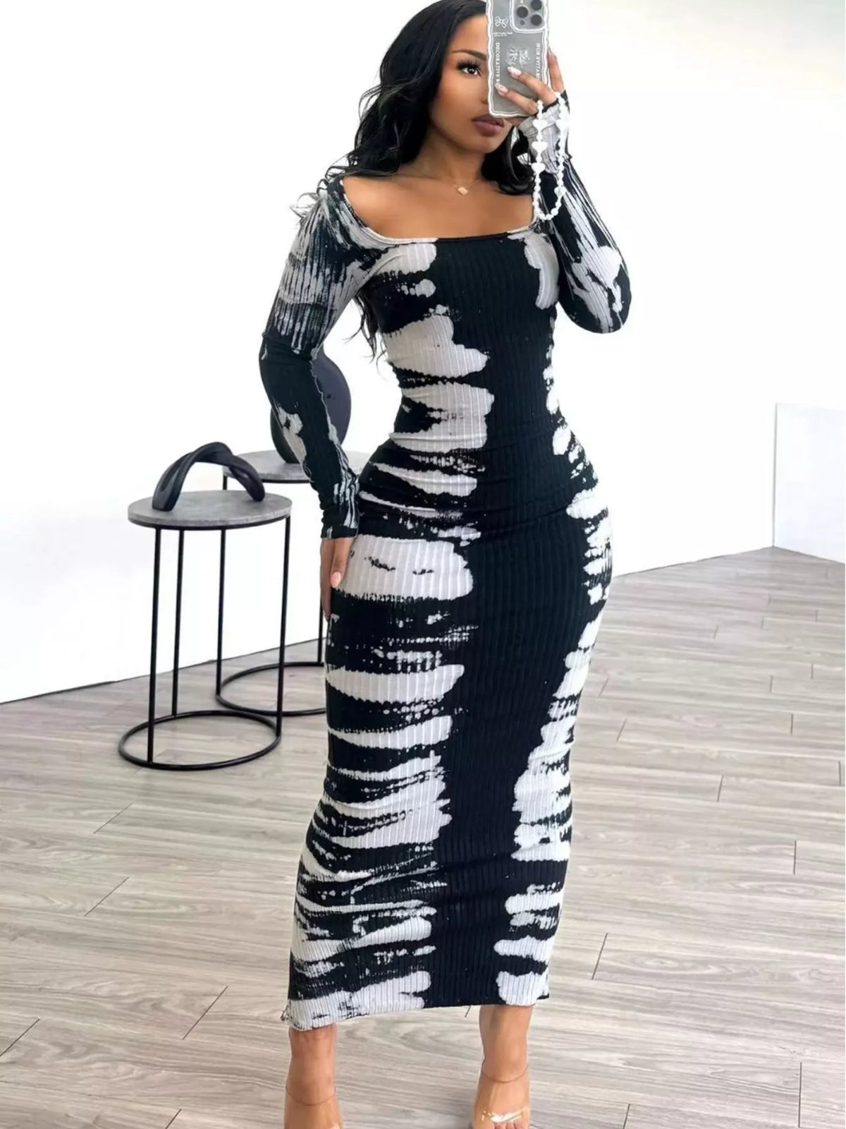 Colorful tie-dye long sleeve maxi dress by Plush Fashion Hub, featuring a flowing design and vibrant pattern.