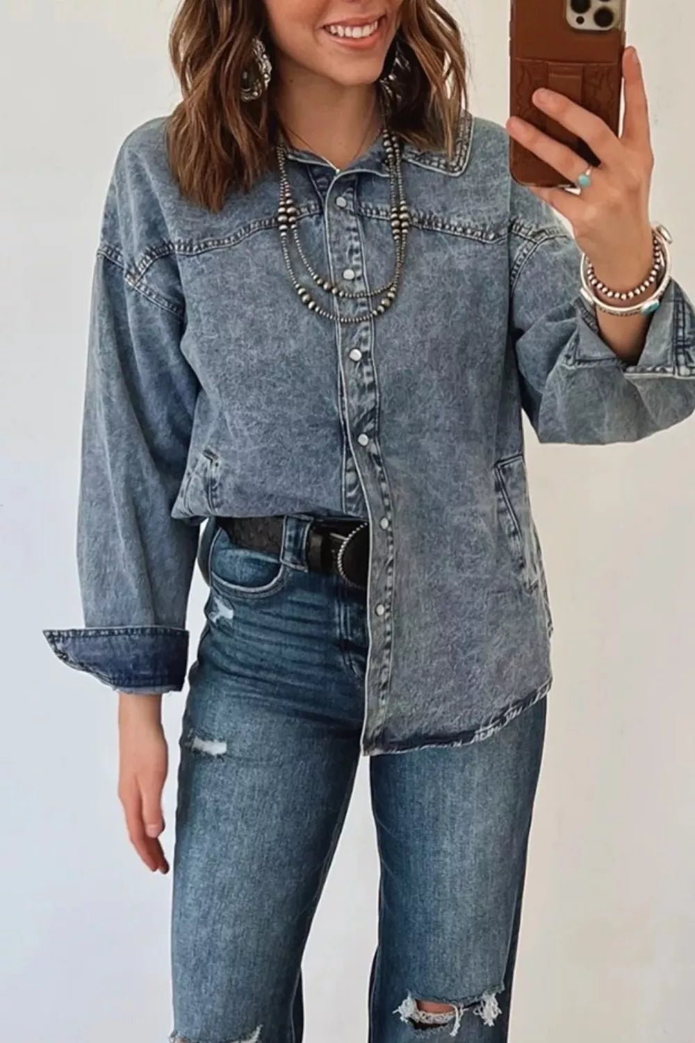 Western long sleeve denim jacket with collar, trendy tunic style, made by Trendsi, shown in a casual, rugged design.
