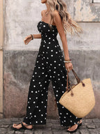 Flowy black and white polka dot strapless jumpsuit with wide legs, designed by Trendsi for a comfortable, fashionable look.