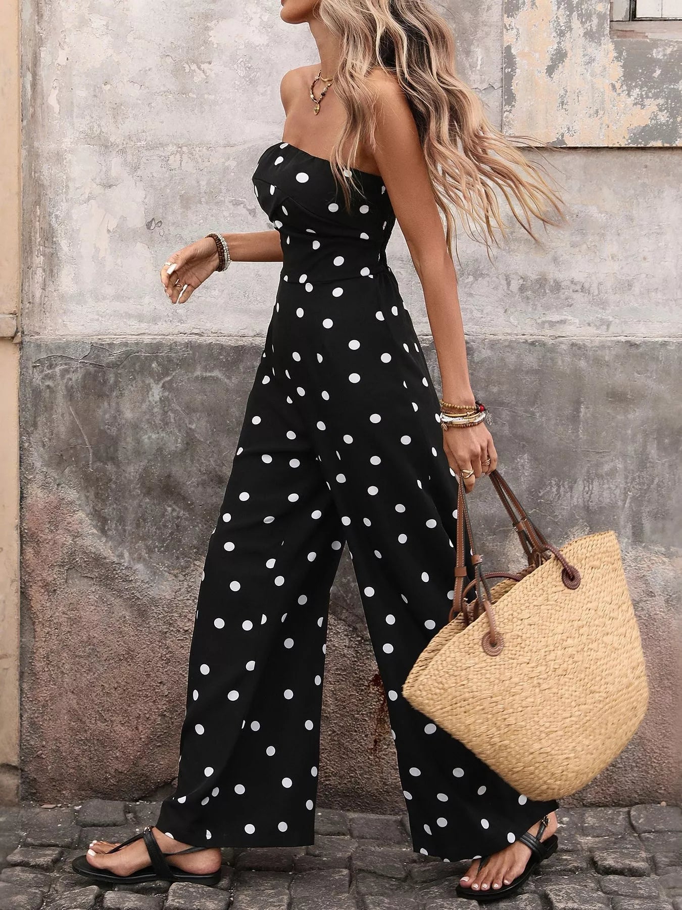 Flowy black and white polka dot strapless jumpsuit with wide legs, designed by Trendsi for a comfortable, fashionable look.