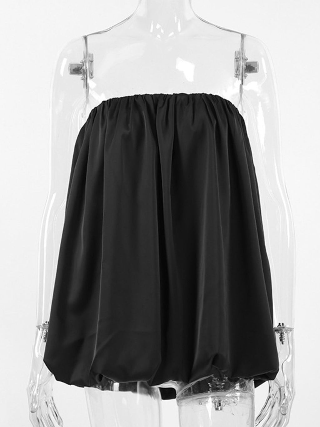 Women's strapless bubble hem tube top by Trendsi, sleek minimalist crop top with a trendy design, shown on a model.