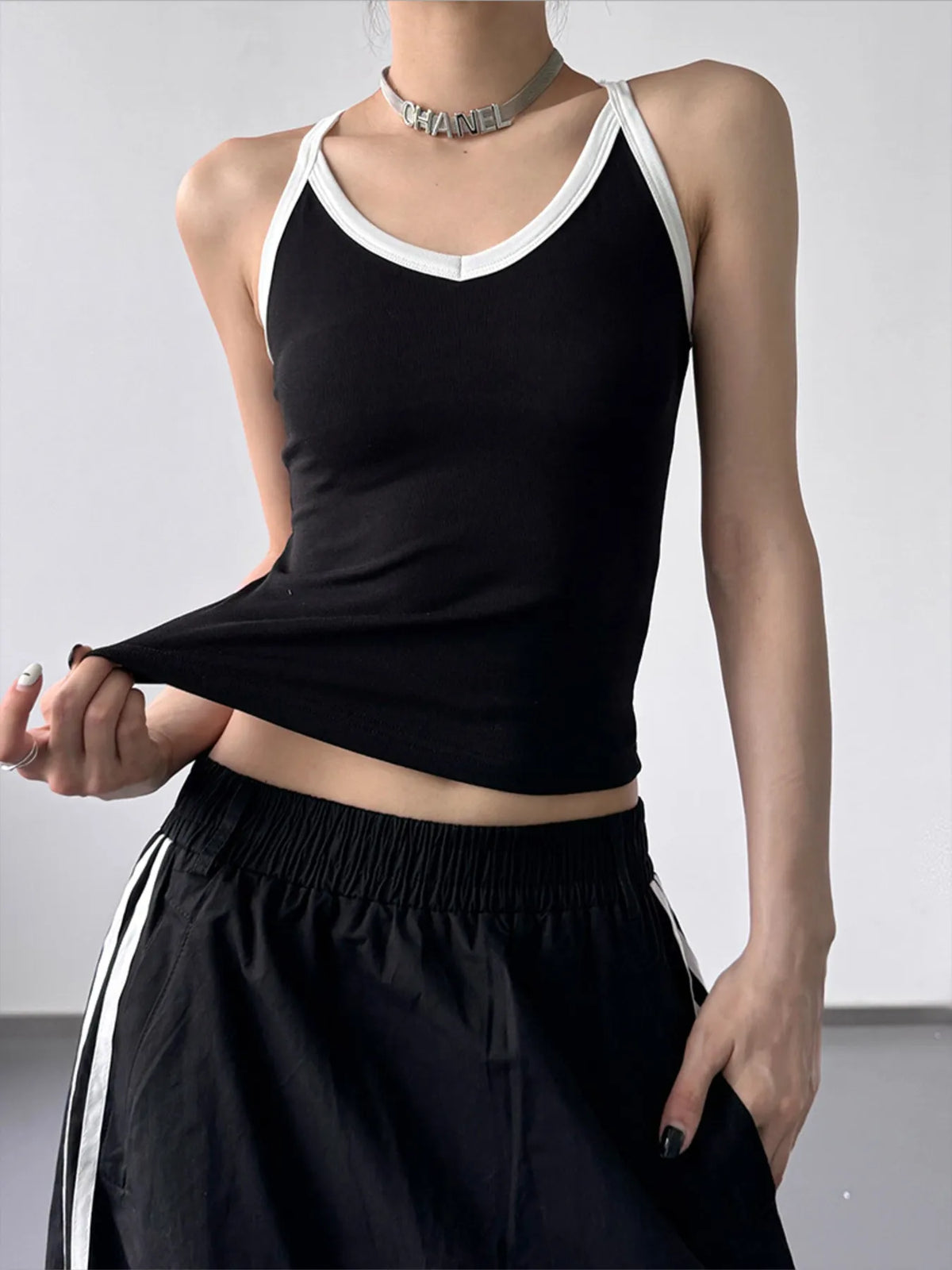Plush Fashion Hub contrast trim cami top featuring a fitted sleeveless design with subtle contrast details on the neckline and straps.